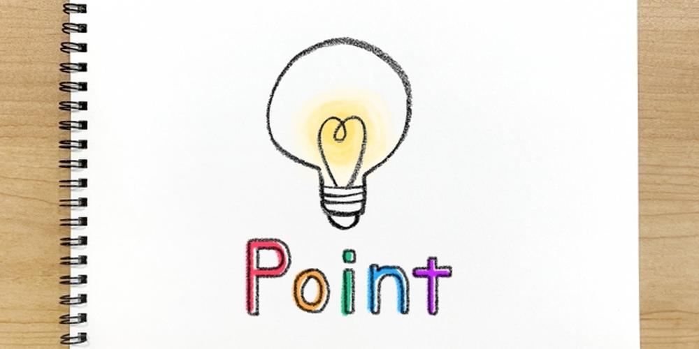 「手描き風の電球イラストと“Point”のカラフルな文字が描かれたスケッチブック」