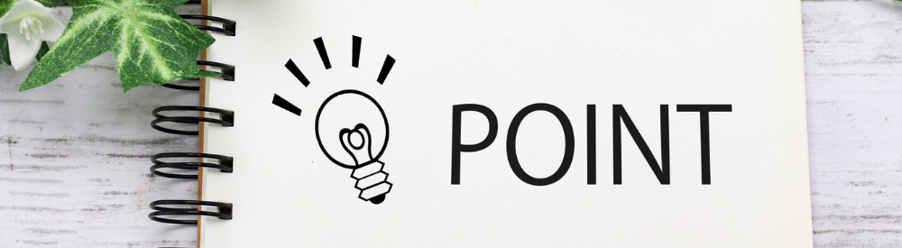 ノートに書かれた電球のアイコンと「POINT」という文字